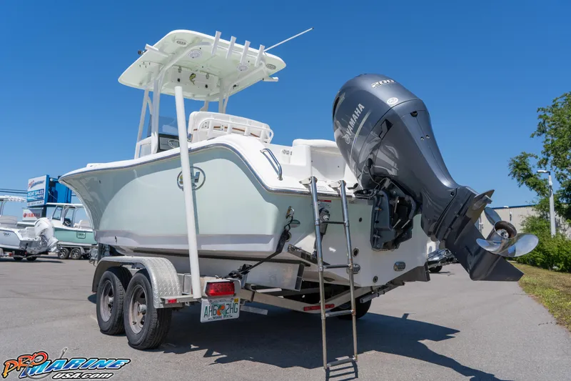 Slide: The Image of 2019 Sea Hunt Ultra 234 boat on trailer with Yamaha outboard motor. - 7
