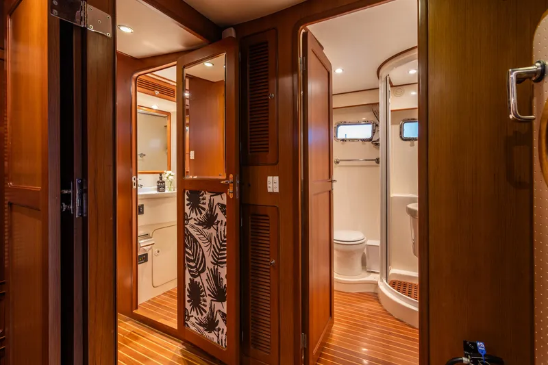 Slide: The Image of Luxurious 2003 Selene 47 yacht interior with wooden finishes and modern bathroom amenities. - 10