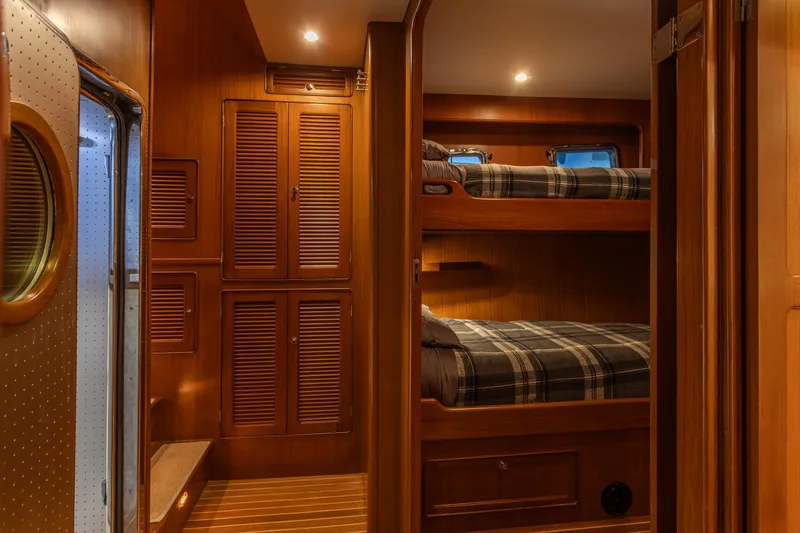 Slide: The Image of Cozy cabin interior with wooden bunk beds on a 2003 Selene 47 yacht. - 11
