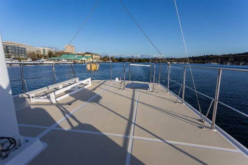 Slide: The Image of Deck view of 2003 Selene 47 yacht on calm water under clear blue sky. - 19