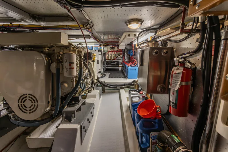 Slide: The Image of Engine room of a 2003 Selene 47 yacht, featuring machinery and safety equipment. - 25