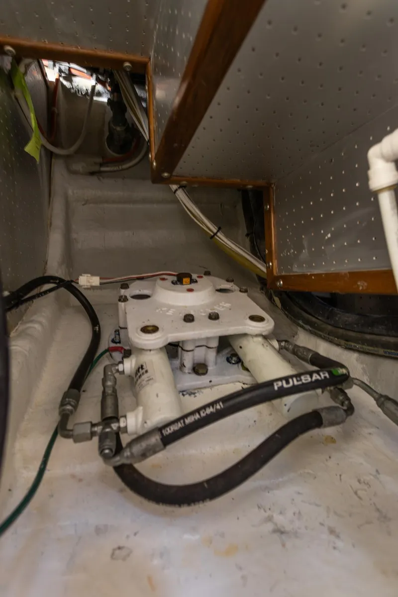 Slide: The Image of Engine room of 2003 Selene 47 yacht, showcasing mechanical components and piping. - 26