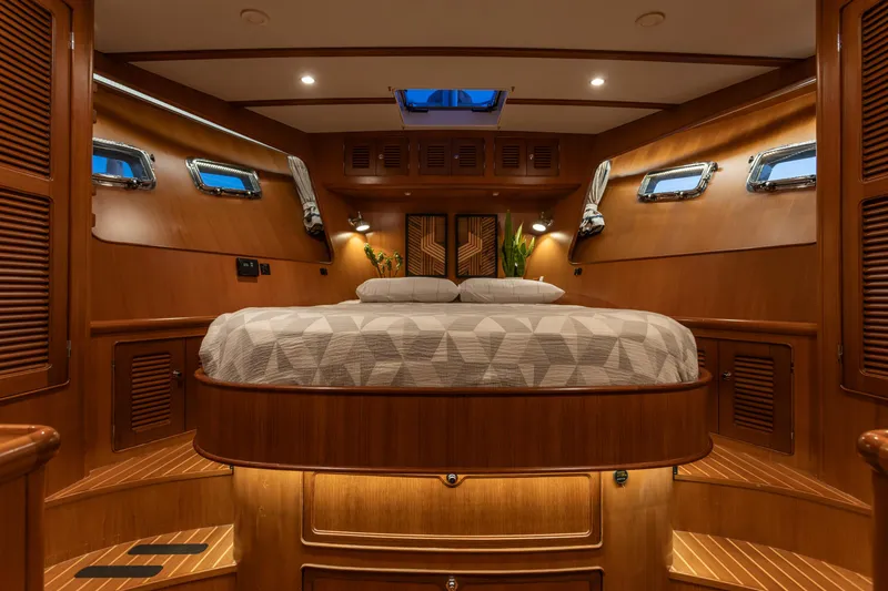 Slide: The Image of Luxurious cabin interior of 2003 Selene 47 yacht with elegant wood finish and cozy bedding. - 3