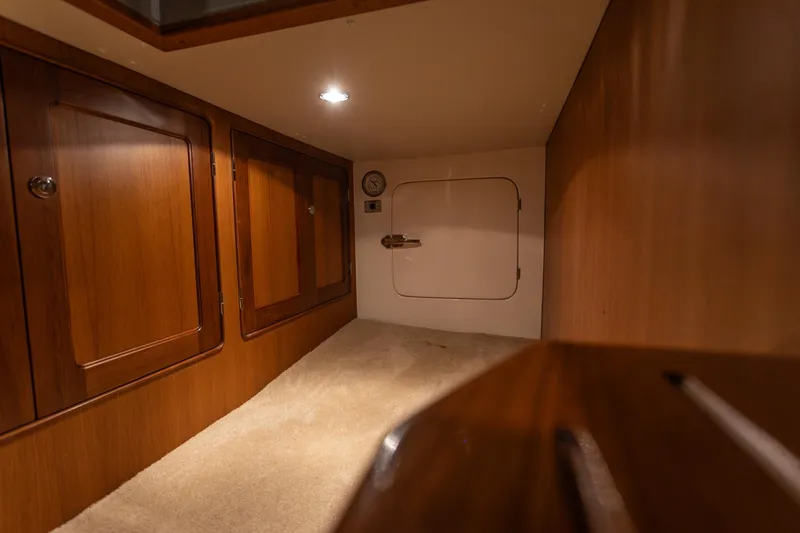 Slide: The Image of Cozy interior of 2003 Selene 47 yacht with wooden cabinets and soft lighting. - 30