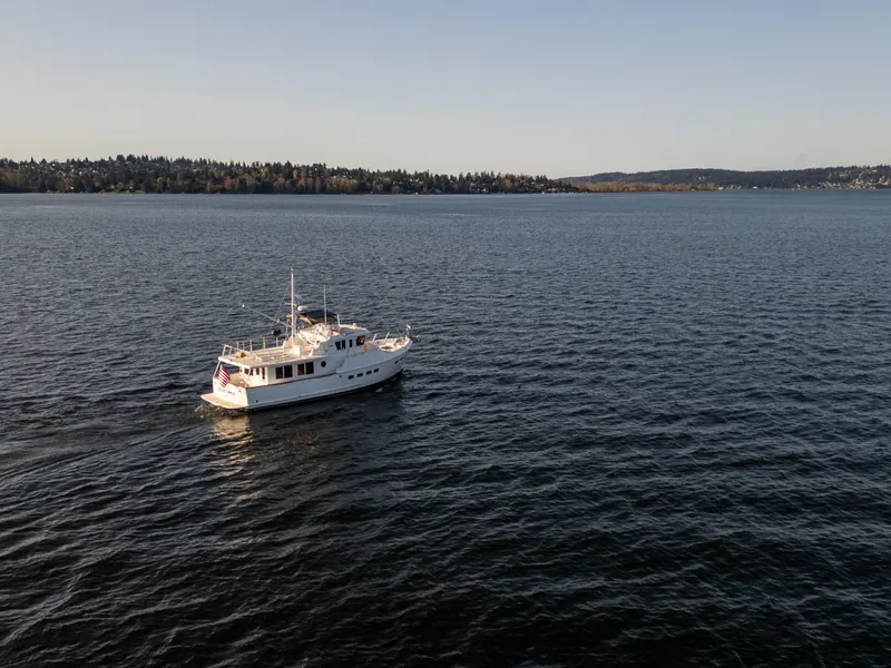 Slide: The Image of Selene 47 yacht from 2003 cruising on a calm lake under clear skies. - 33