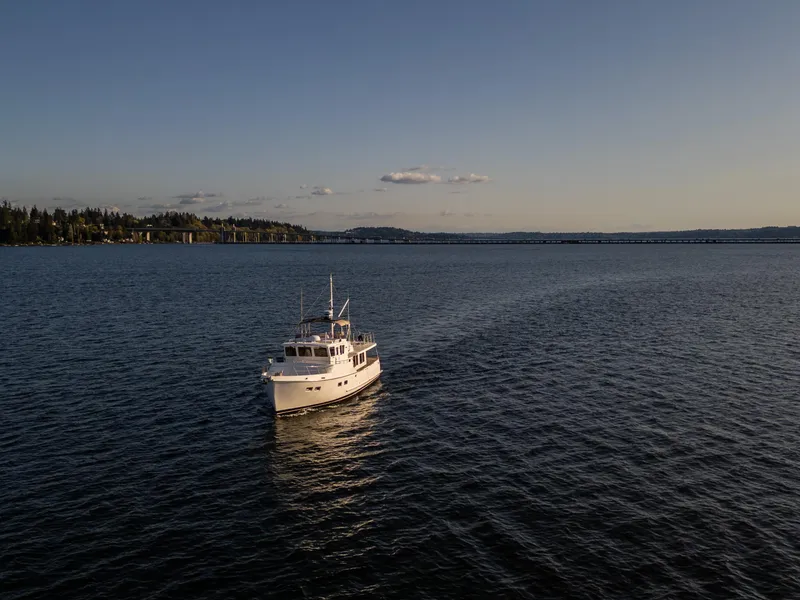 Slide: The Image of Selene 47 yacht cruising on a calm lake at sunset, 2003 model. - 34