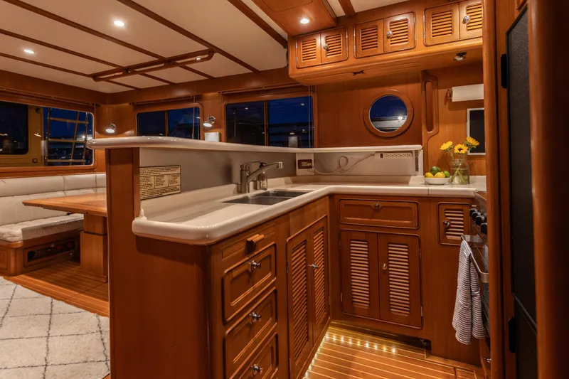 Slide: The Image of Luxurious wooden interior of 2003 Selene 47 yacht kitchen with elegant lighting. - 5