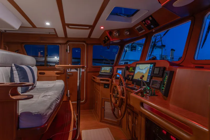 Slide: The Image of Pilothouse interior of 2003 Selene 47 yacht with navigation equipment and seating. - 7