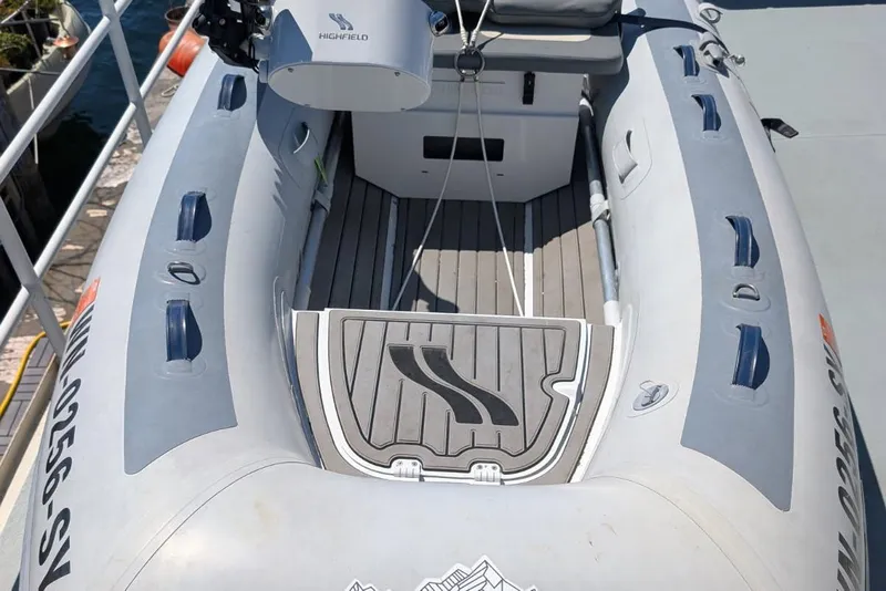 Slide: The Image of Inflatable boat with Highfield motor, docked, featuring Selene 47 model, 2003. - 8