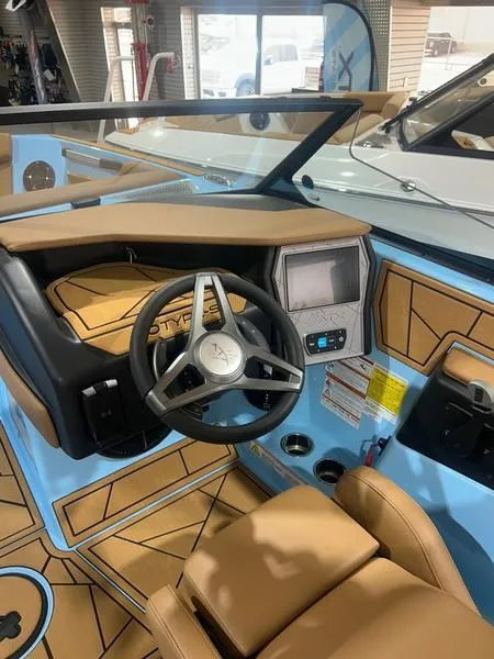 Slide: The Image of 2025 ATX Surf Boats 20 Type-S interior with modern dashboard and steering wheel. - 1