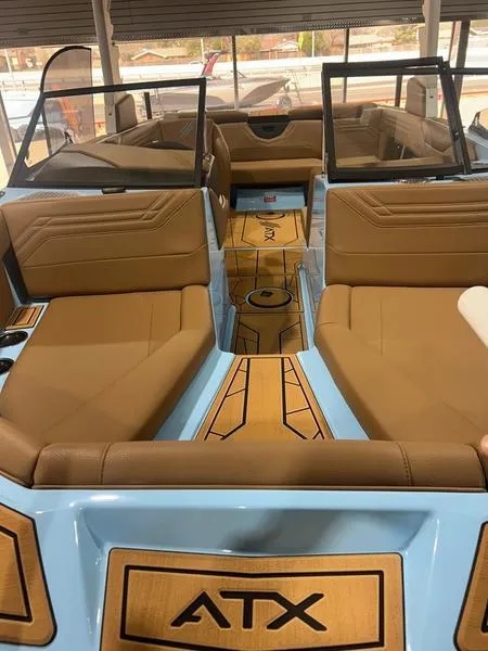 Slide: The Image of 2025 ATX Surf Boats 20 Type-S interior with tan seating and sleek design. - 2