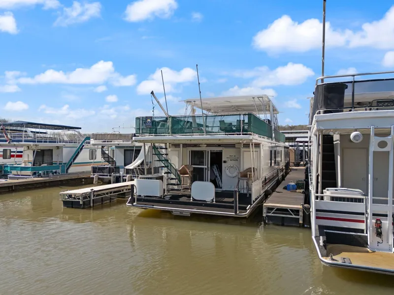 Slide: The Image of 1998 Sharpe 16 X 80 Widebody Houseboat docked on a sunny day. - 10