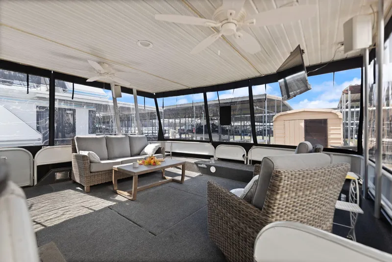 Slide: The Image of Spacious 1998 Sharpe houseboat interior with comfortable seating and modern amenities. - 15