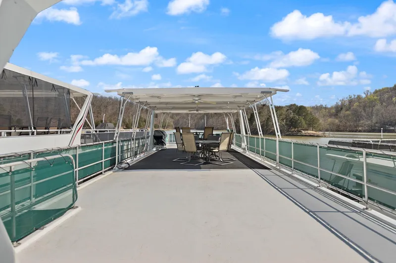 Slide: The Image of 1998 Sharpe 16 X 80 Widebody Houseboat with spacious deck and outdoor seating. - 24