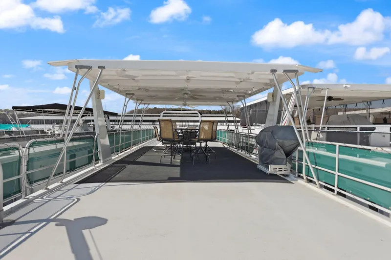 Slide: The Image of 1998 Sharpe 16 X 80 Widebody Houseboat with spacious deck and outdoor seating. - 26