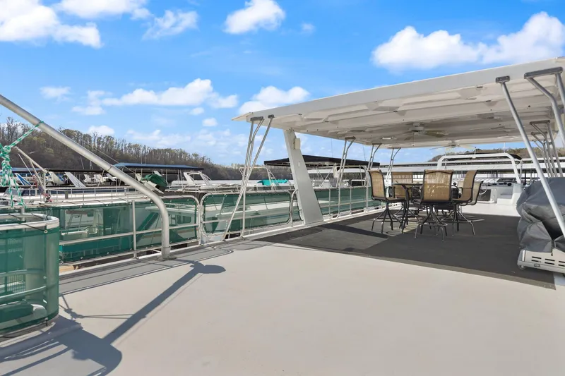 Slide: The Image of 1998 Sharpe 16 X 80 Widebody Houseboat with spacious deck and outdoor seating. - 27