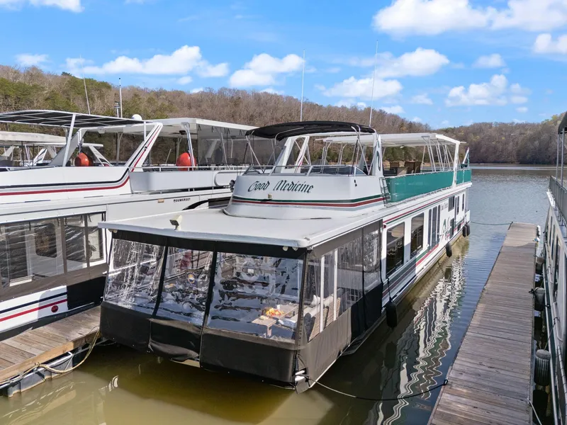Slide: The Image of 1998 Sharpe 16 X 80 Widebody Houseboat docked on a sunny day. - 4