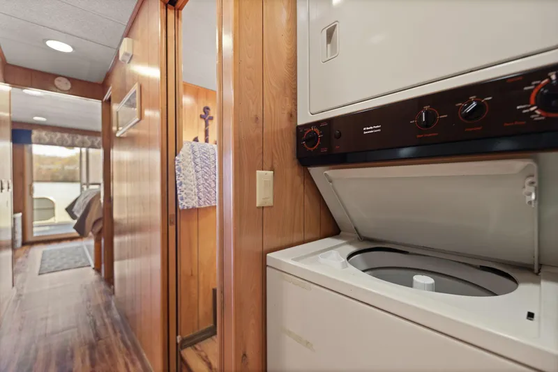Slide: The Image of 1998 Sharpe houseboat interior with wood paneling and laundry area. - 43