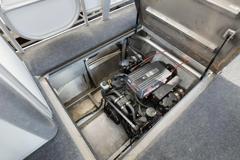 Slide: The Image of Engine compartment of a 1998 Sharpe 16 X 80 Widebody Houseboat, showcasing mechanical details. - 58