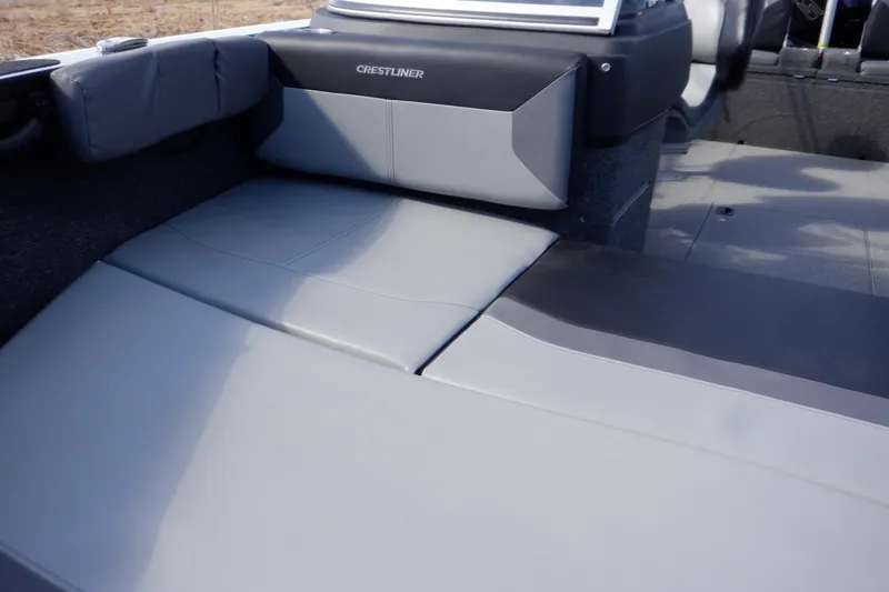Slide: The Image of 2022 Crestliner 1950 Super Hawk boat interior with gray seating and sleek design. - 10