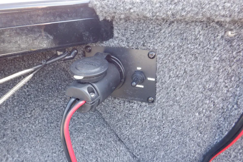 Slide: The Image of 2022 Crestliner 1950 Super Hawk electrical panel with power socket and switch. - 19