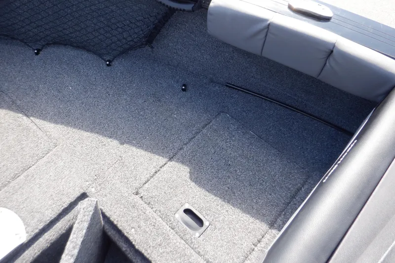 Slide: The Image of Interior view of 2022 Crestliner 1950 Super Hawk boat, featuring carpeted flooring and seating. - 26