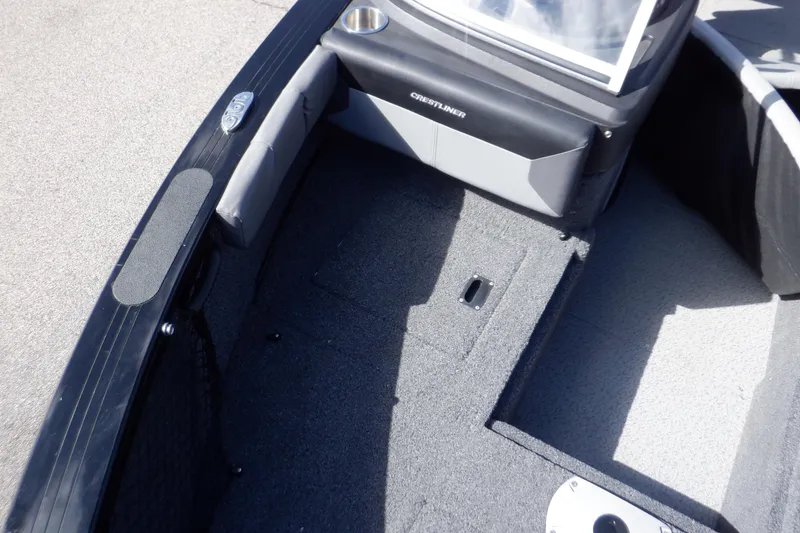 Slide: The Image of 2022 Crestliner 1950 Super Hawk boat interior with gray carpet and seating area. - 30