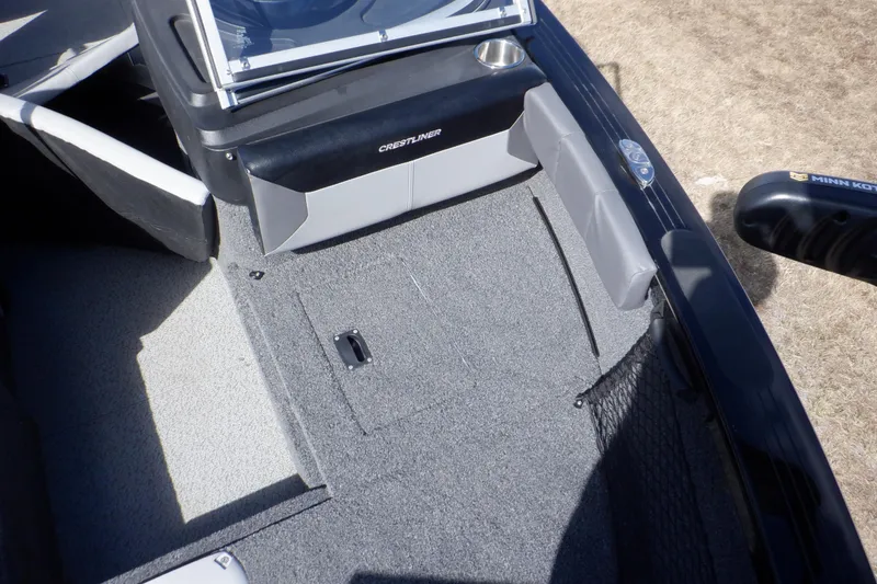 Slide: The Image of 2022 Crestliner 1950 Super Hawk boat interior with gray carpet and seating. - 31