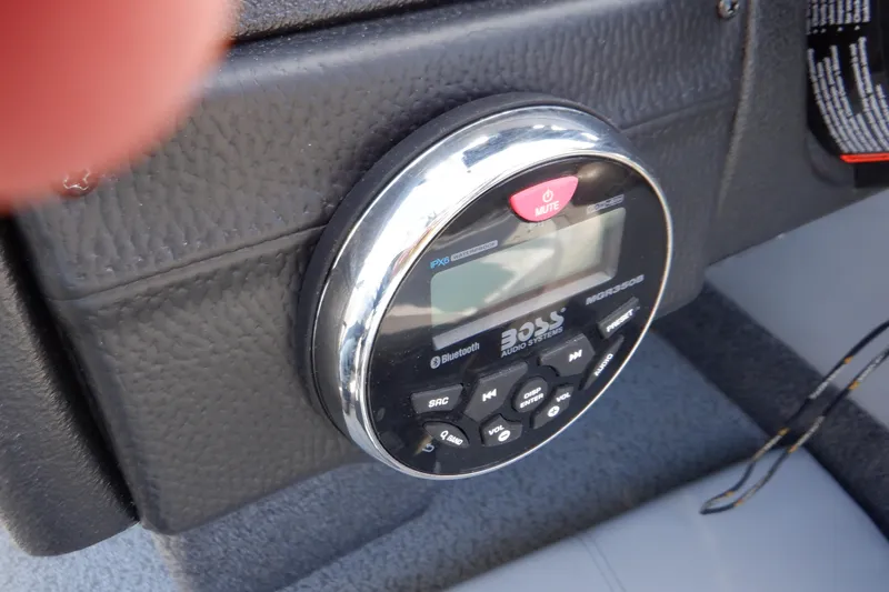 Slide: The Image of Control panel of a 2022 Crestliner 1950 Super Hawk boat with a Boss audio system. - 32