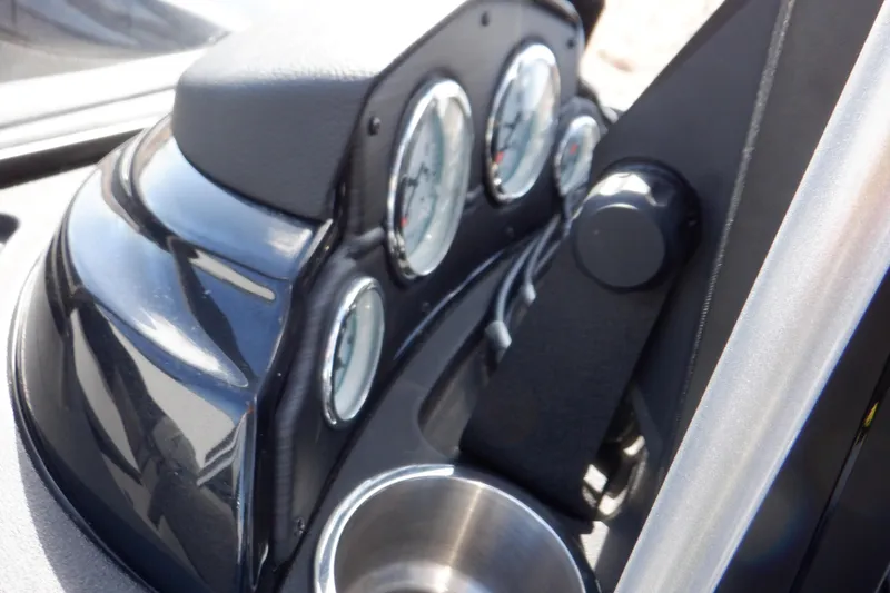 Slide: The Image of Dashboard of 2022 Crestliner 1950 Super Hawk with gauges and cup holder. - 33