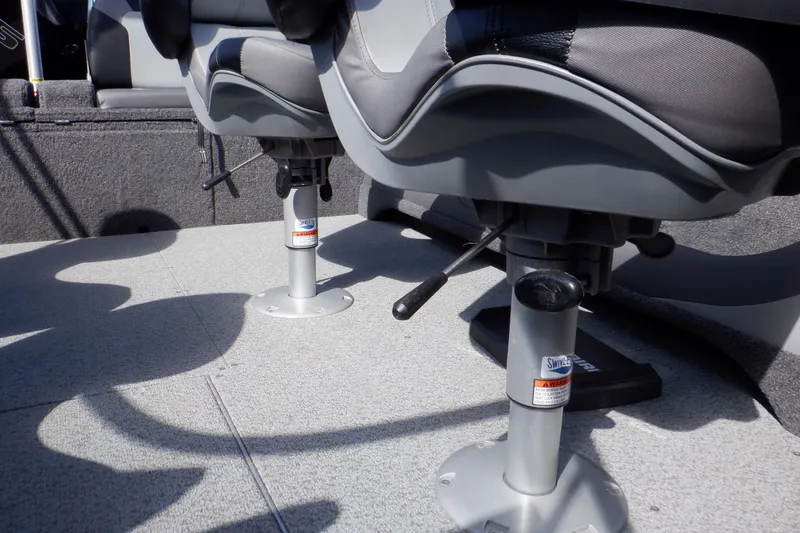 Slide: The Image of 2022 Crestliner 1950 Super Hawk boat seats with adjustable pedestals on a textured deck. - 34