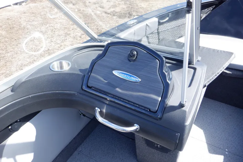 Slide: The Image of 2022 Crestliner 1950 Super Hawk dashboard with storage compartment and cup holder. - 36