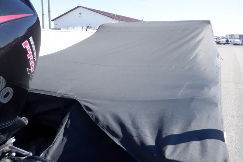 Slide: The Image of 2022 Crestliner 1950 Super Hawk with protective cover, partial view of outboard motor. - 6