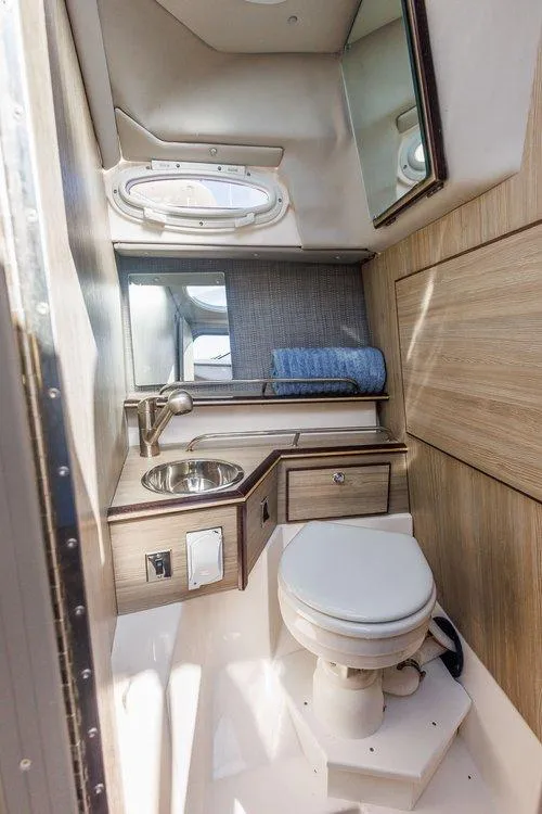 Slide: The Image of Compact bathroom in 2026 Solara S-250 Coupe with sink, toilet, and mirror. - 14