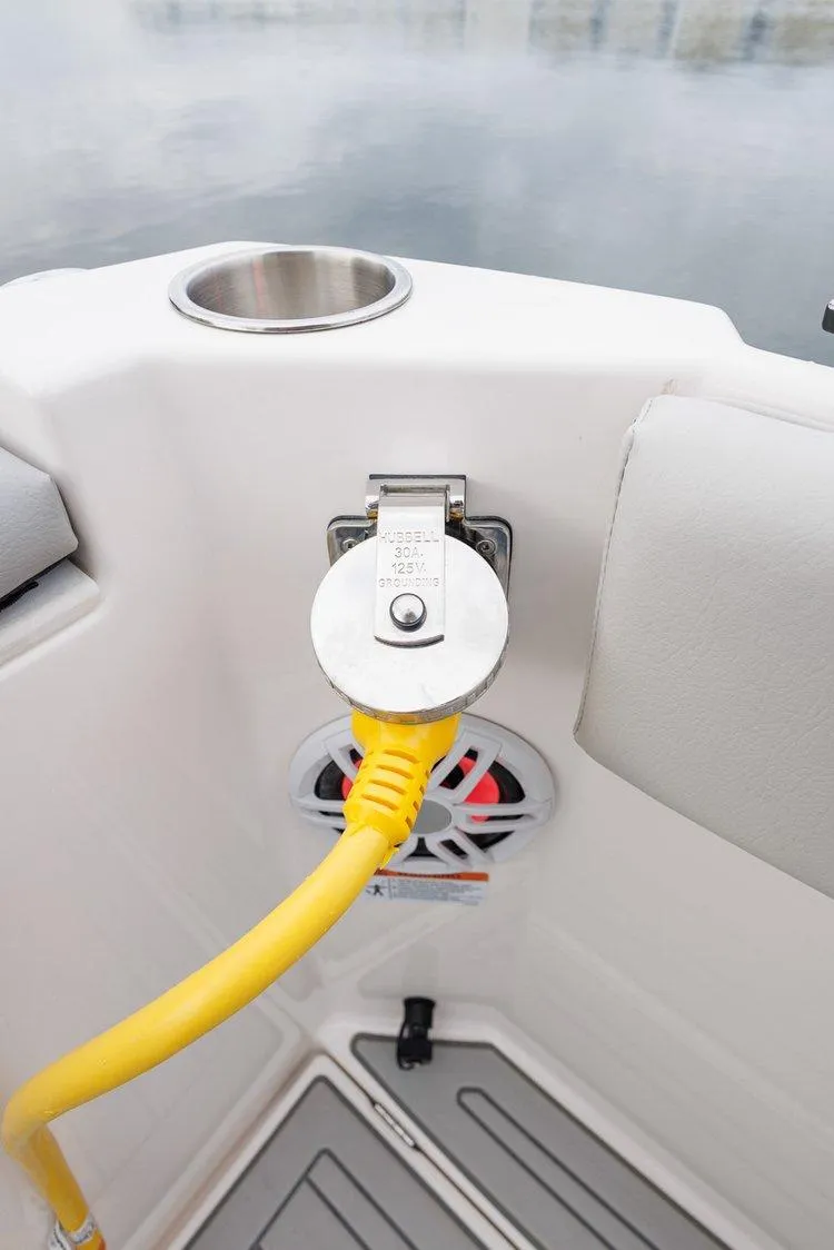 Slide: The Image of 2026 Solara S-250 Coupe boat with yellow power cable and cup holder on deck. - 26