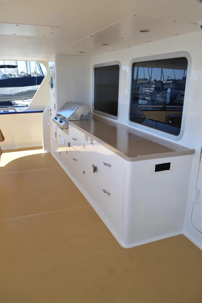 Slide: The Image of Outdoor kitchen on 2018 Allseas Expedition yacht with sleek countertops and storage cabinets. - 20