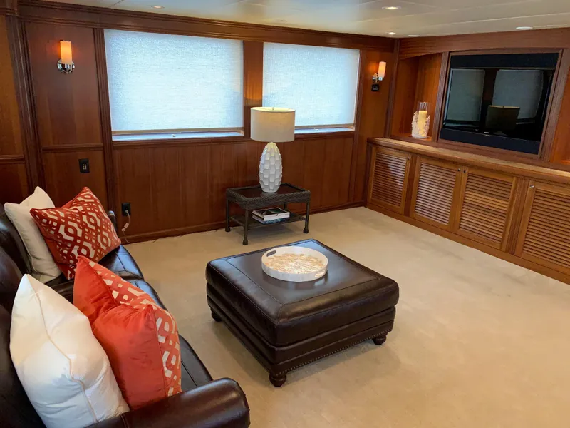 Slide: The Image of Luxurious Allseas Expedition yacht interior, featuring elegant seating, decorative pillows, and a large TV. - 22