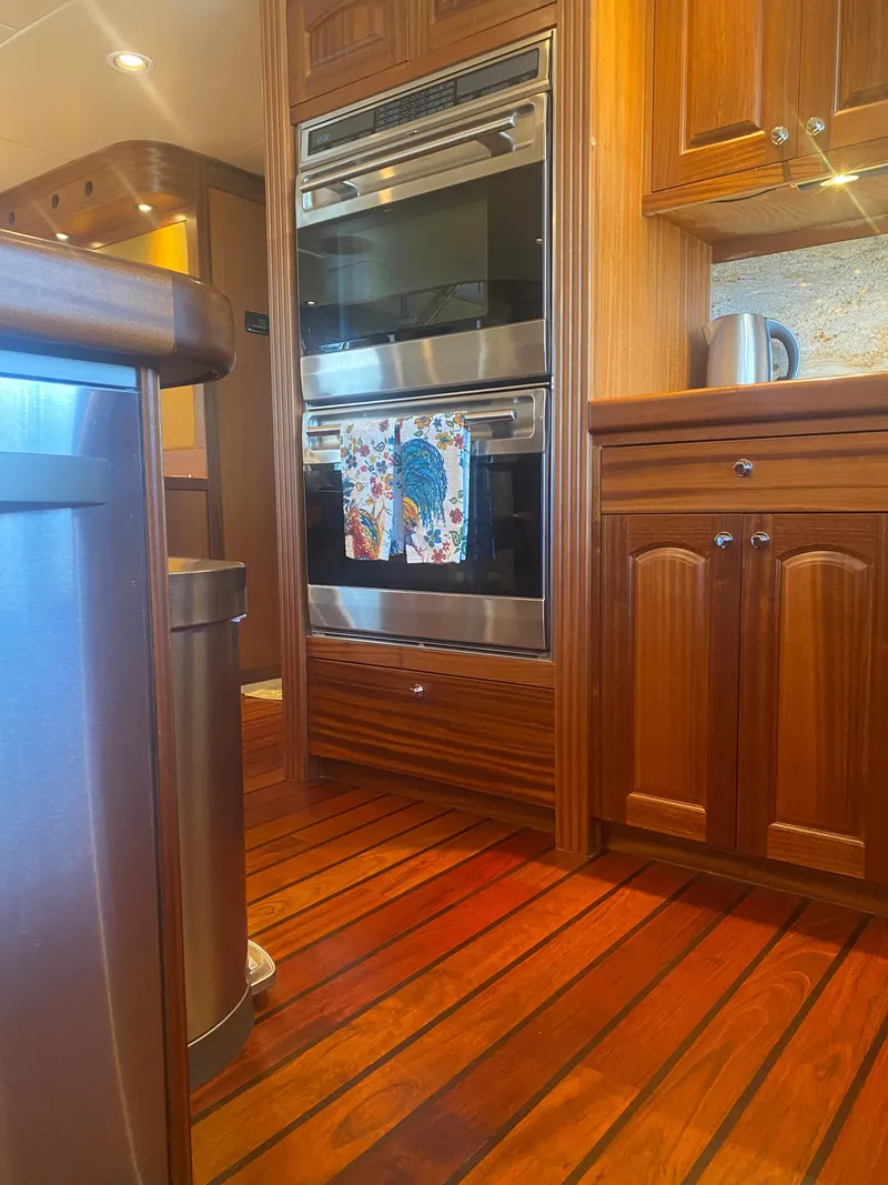 Slide: The Image of Luxurious Allseas Expedition 2018 yacht kitchen with wood cabinetry and modern appliances. - 32