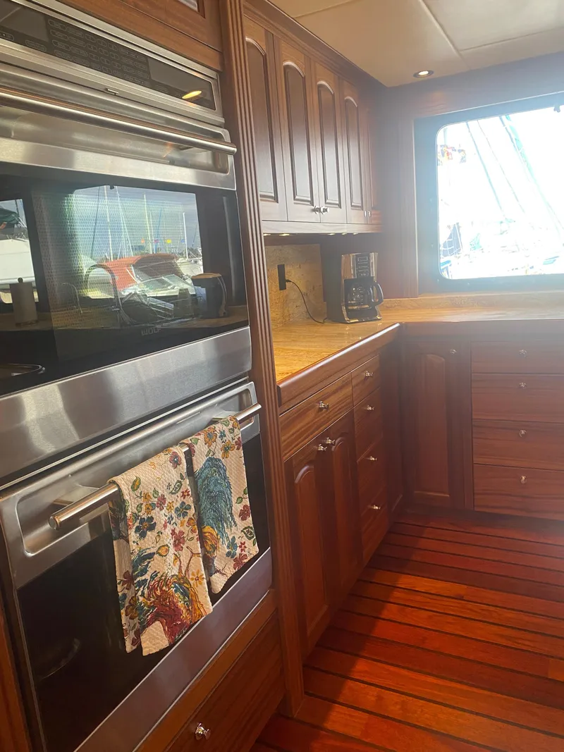 Slide: The Image of Luxurious wooden kitchen interior on 2018 Allseas Expedition yacht, featuring modern appliances. - 33