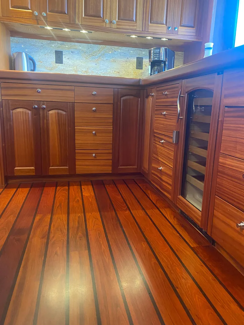 Slide: The Image of Luxurious wooden kitchen interior on 2018 Allseas Expedition yacht, featuring elegant cabinetry and flooring. - 34