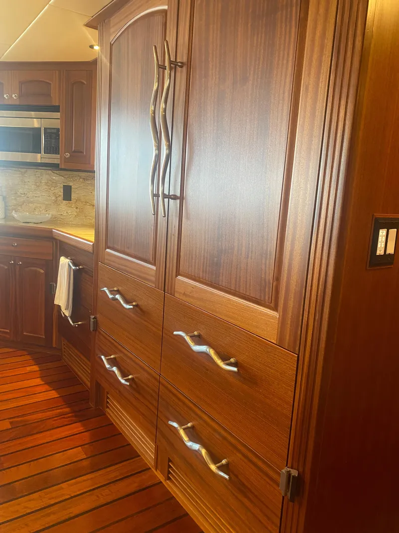 Slide: The Image of Luxurious wooden kitchen cabinetry in 2018 Allseas Expedition yacht, featuring modern handles and sleek design. - 36