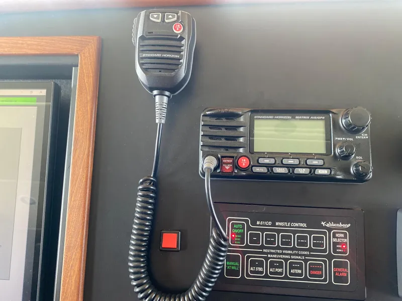 Slide: The Image of Control panel with radio equipment on Allseas Expedition, 2018 model, featuring microphone and display. - 43