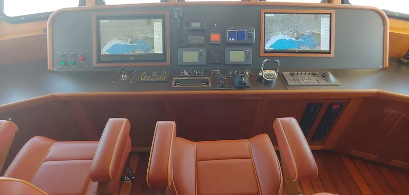 Slide: The Image of Allseas Expedition 2018 yacht cockpit with navigation screens and leather seats. - 44