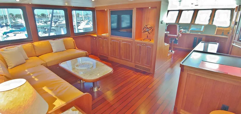 Slide: The Image of Luxurious Allseas Expedition yacht interior with wood paneling, plush seating, and large windows, 2018 model. - 46
