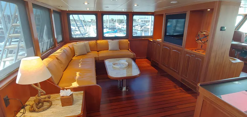Slide: The Image of Luxurious Allseas Expedition yacht interior with wood flooring, cozy seating, and large windows, 2018 model. - 48