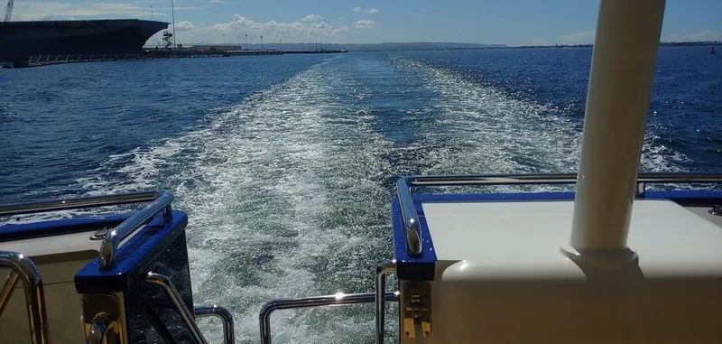 Slide: The Image of Wake trail behind Allseas Expedition yacht, 2018, cruising on open water under clear skies. - 5