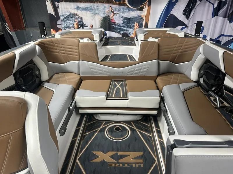 Slide: The Image of Luxurious interior of 2025 Tigé Ultré 23ZX boat with brown and white seating. - 5
