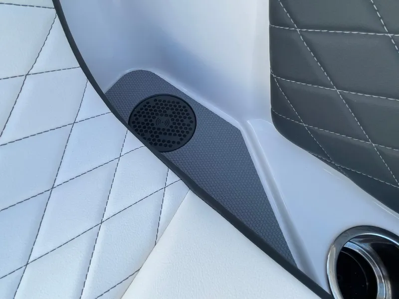 Slide: The Image of 2025 Chaparral 267 SSX interior with quilted upholstery and speaker detail. - 12