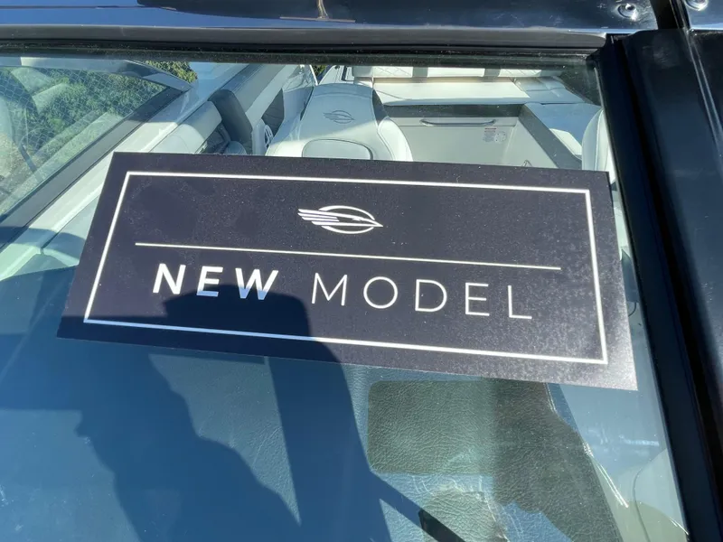 Slide: The Image of 2025 Chaparral 267 SSX boat with 'New Model' sign on windshield. - 19