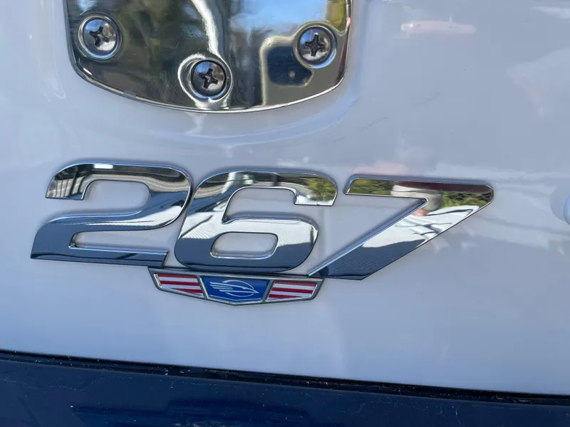 Slide: The Image of 2025 Chaparral 267 SSX emblem on boat exterior, showcasing sleek design and branding. - 2